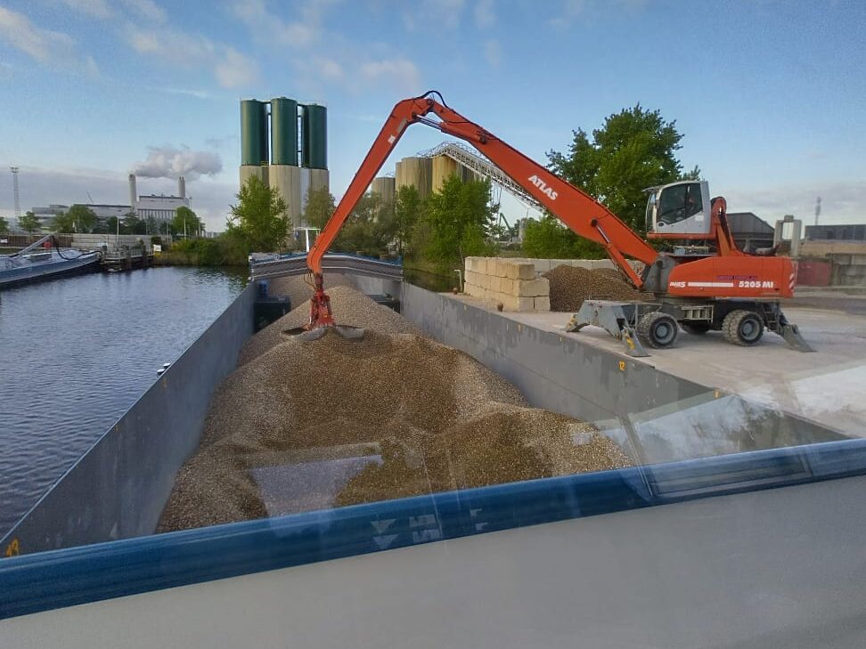 Ship unloading gravel in Amsterdam